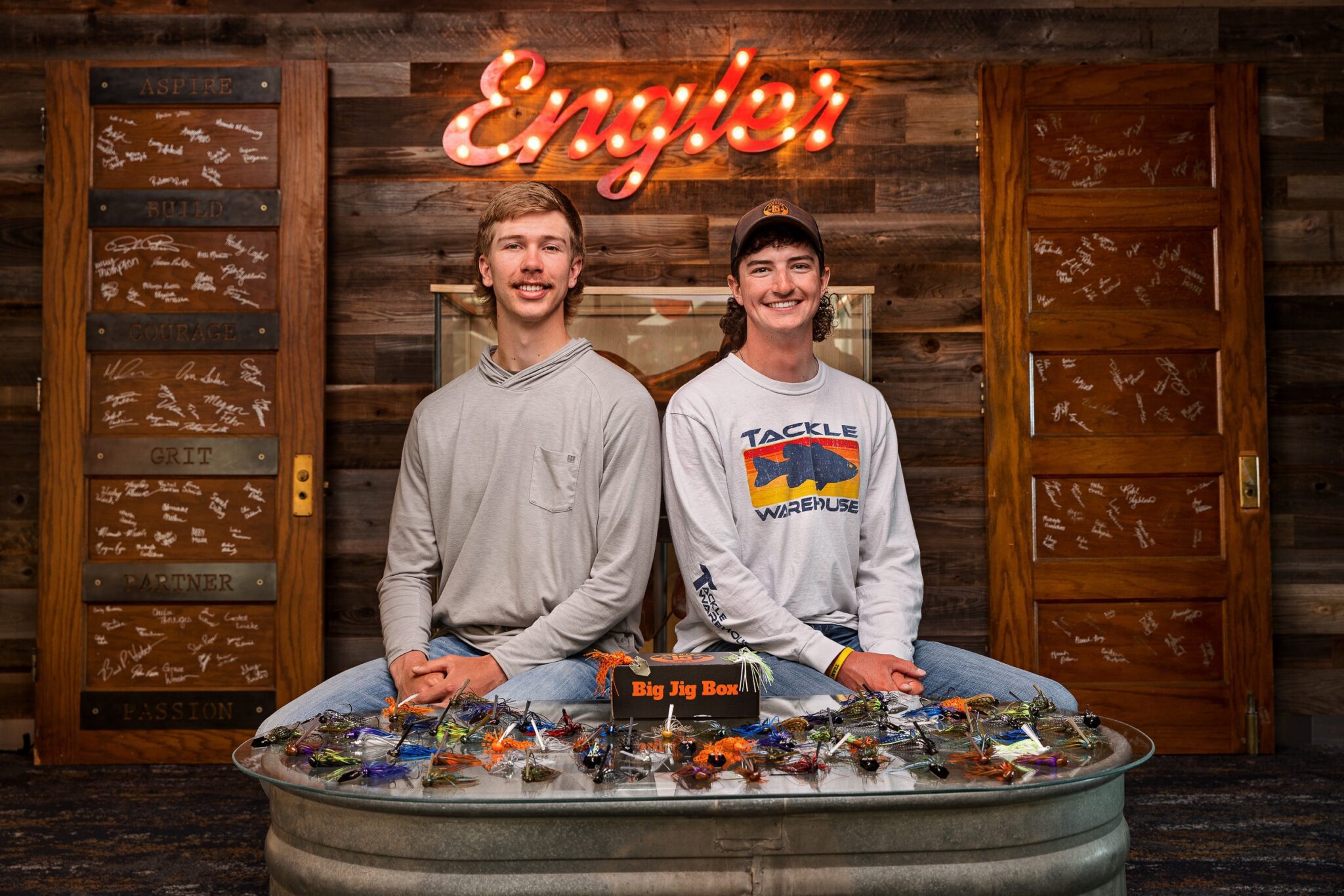 Hunter Suchsland Cade Ludwig posing with their Big Jig Box in the Engler Agribusiness Entrepreneurship Program.