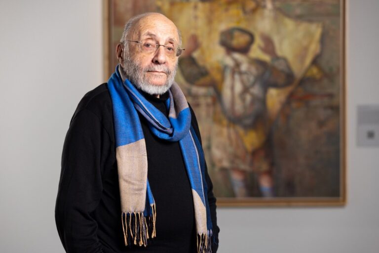 Samuel Bak standing in his new gallery on the UNO campus.