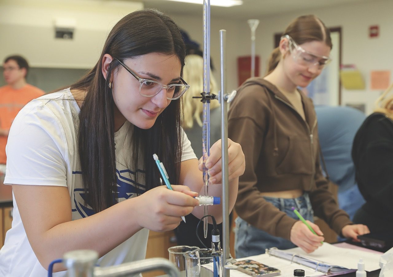 Female student working in laboratory.